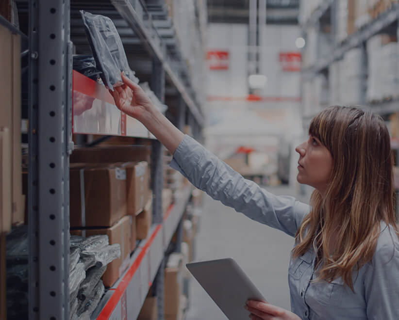 Woman using devices for stock management