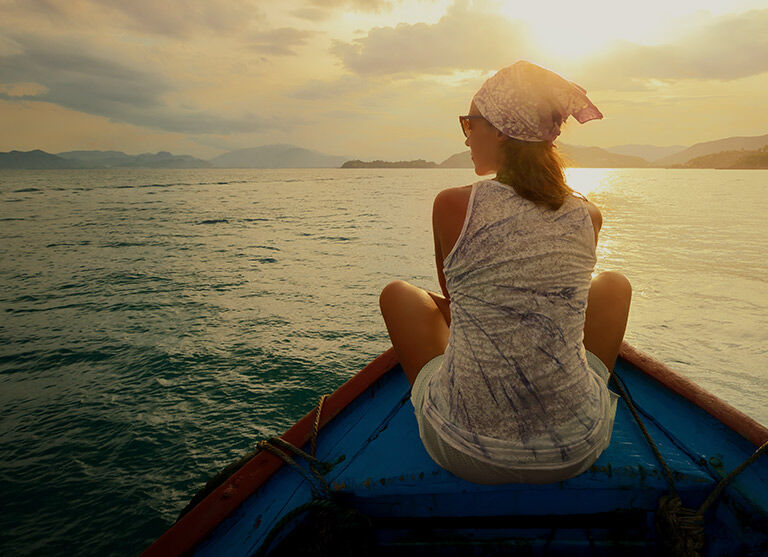 Woman on boat, contemplating